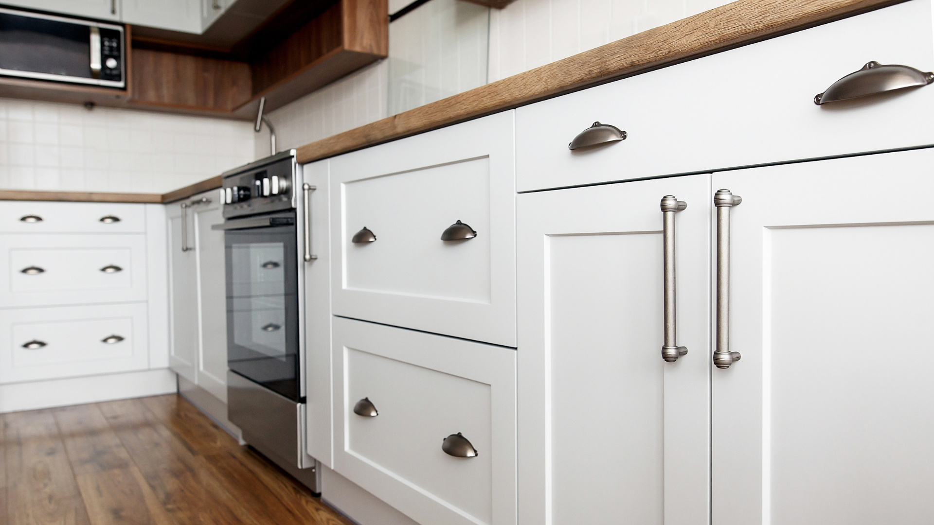 white kitchen cabinets with silver handles